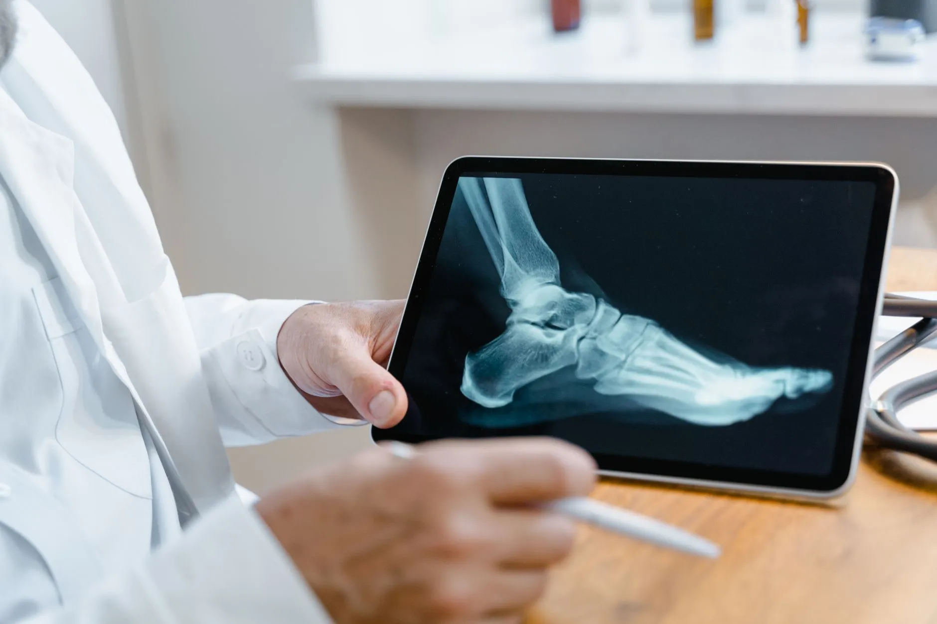 Clinician reviewing diagnostic imaging on a tablet