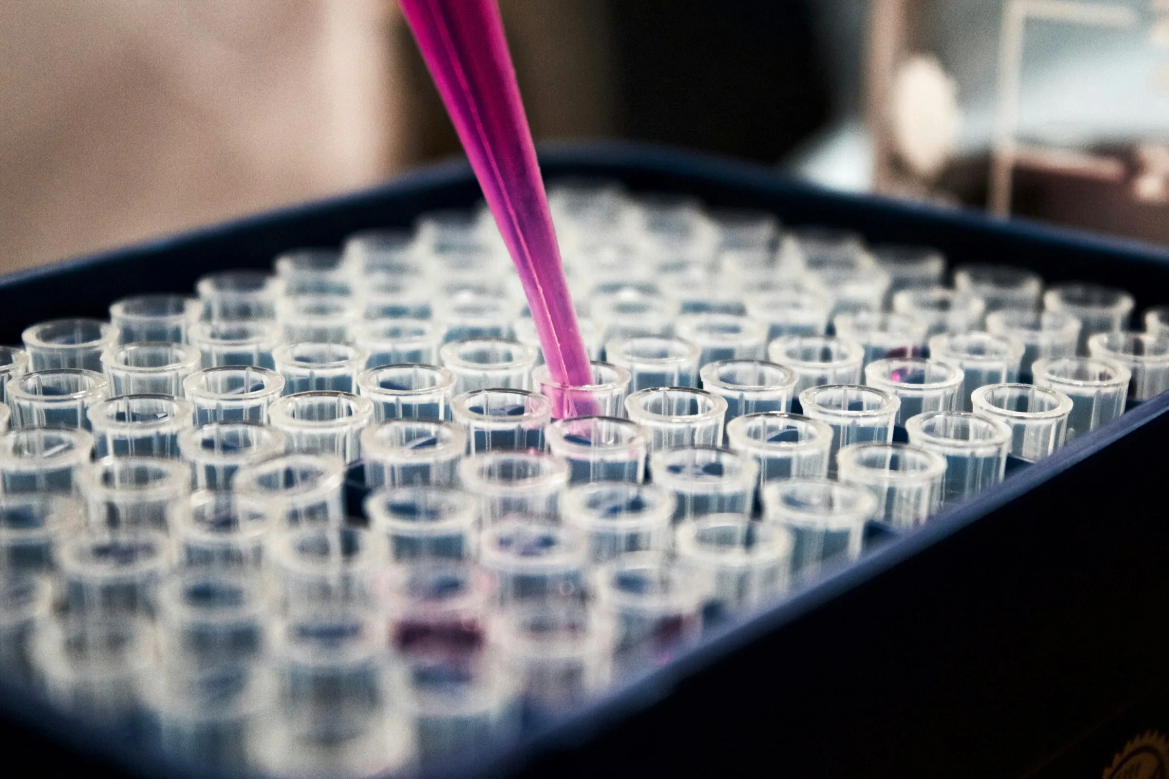 Pipette filling sample vials in a laboratory