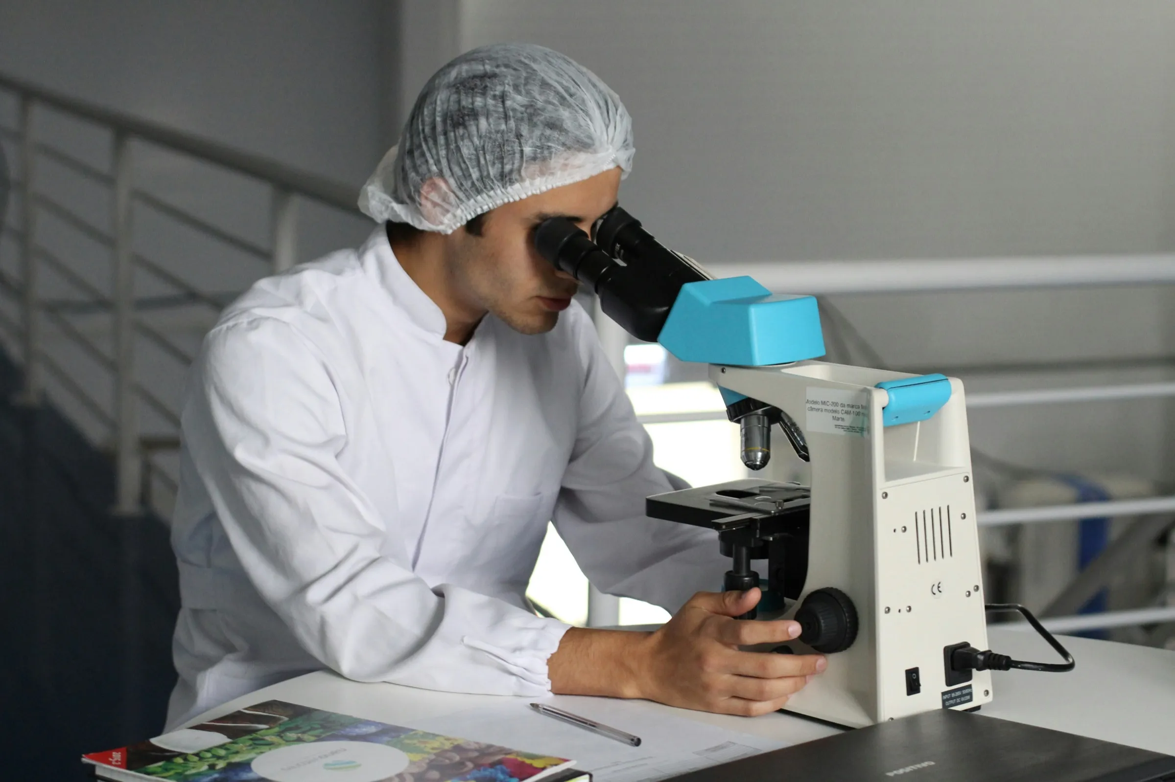 Researcher working at a microscope