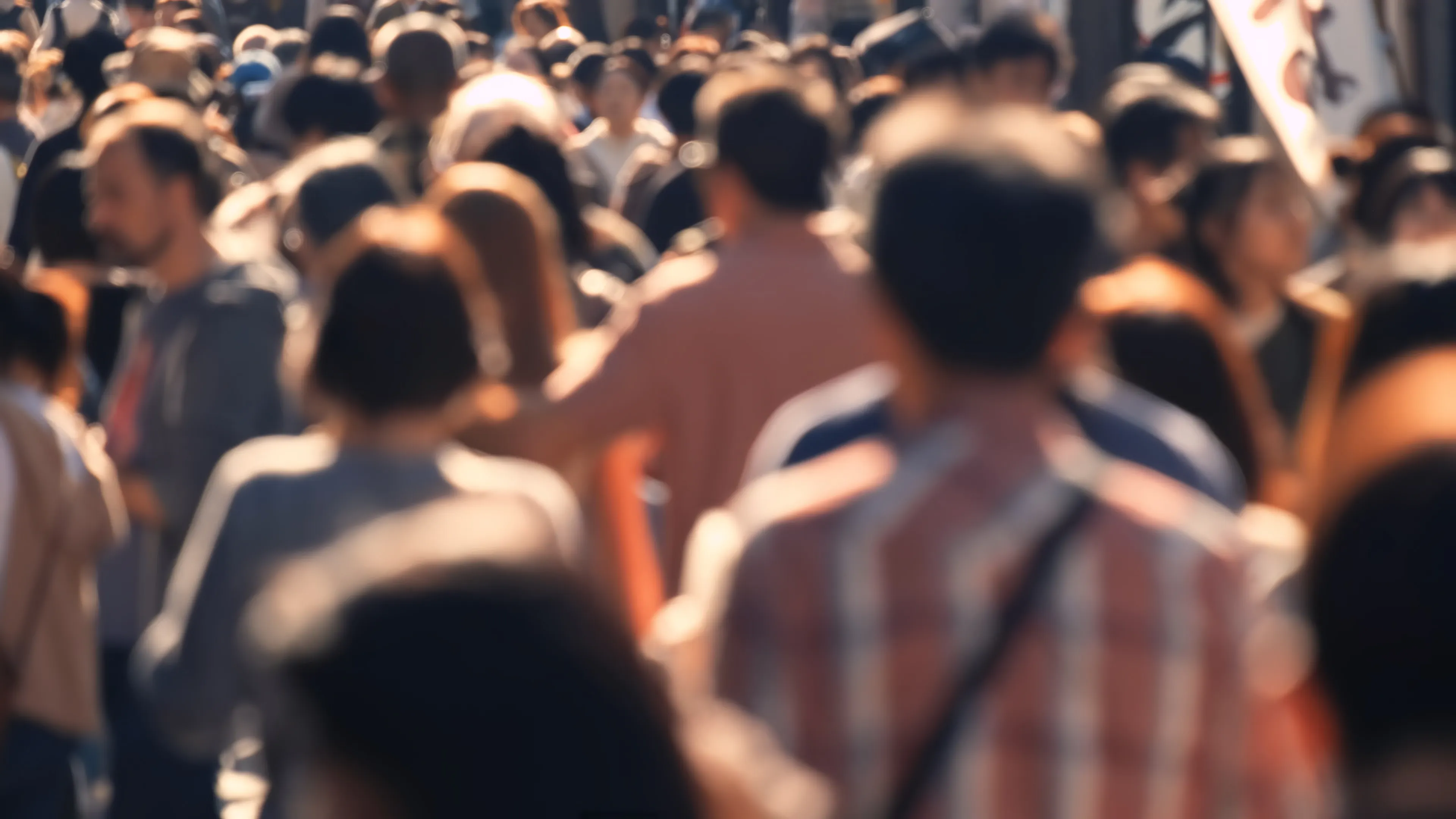 A dense crowd of people seen from above
